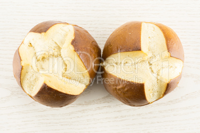 Fresh Bavarian bread bun on grey wood