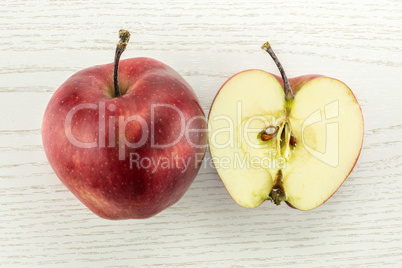 Fresh raw apple red delicious on grey wood