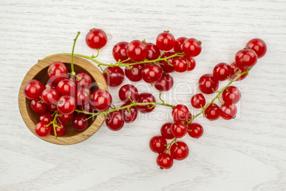 Fresh raw red currant on grey wood