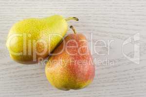 Fresh Raw red pear on grey wood