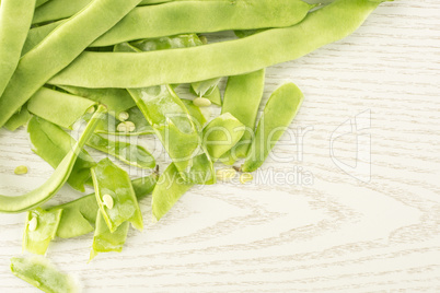 Fresh Flat Green Bean on grey wood