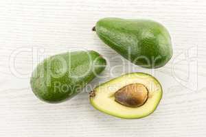 fresh Raw smooth avocado on grey wood
