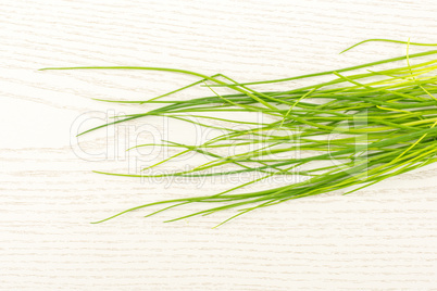 Fresh Raw Chives on grey wood