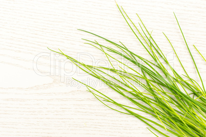 Fresh Raw Chives on grey wood