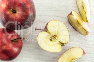 Fresh raw apple red delicious on grey wood