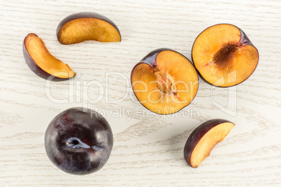 Red Blue Plums on grey wood