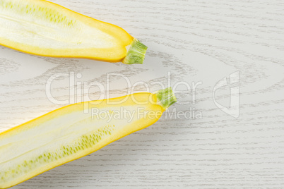 Fresh Raw yellow zucchini on grey wood