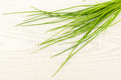 Fresh Raw Chives on grey wood