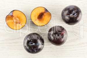 Red Blue Plums on grey wood