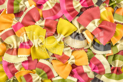 Colourful raw farfalle isolated on white