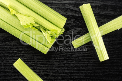 Fresh Celery isolated on black wood