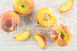 Fresh Raw yellow peach on grey wood