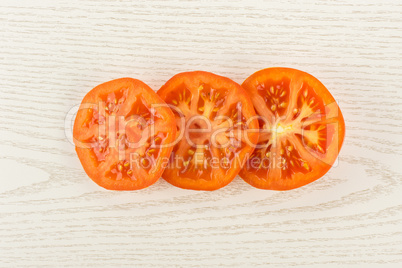 Fresh raw Tomato (La Parcela variety) on grey wood
