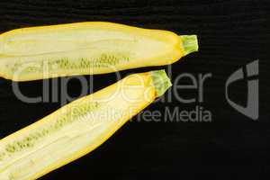 Fresh Raw yellow zucchini on black wood