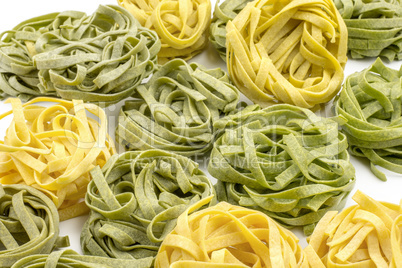 Raw fresh Fettuccine isolated on white