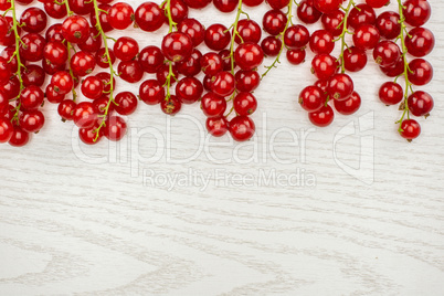 Fresh raw red currant on grey wood