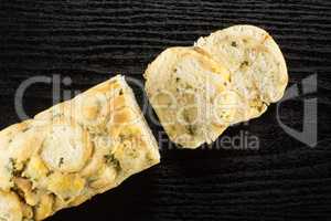 Fresh boiled Carlsbad bread dumpling on black wood