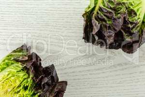 Fresh raw lettuce red little gem on grey wood