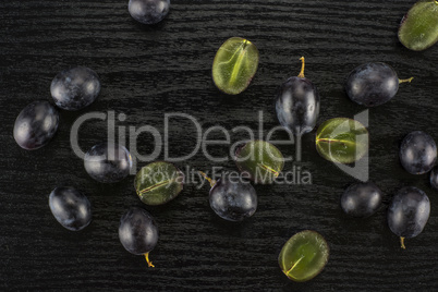 Fresh Black Wine Grapes on Black wood