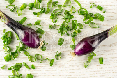 Fresh Raw green spring onion on grey wood