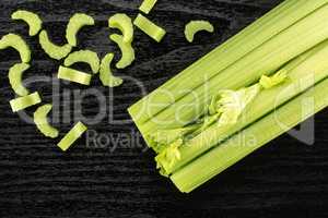 Fresh Celery isolated on black wood
