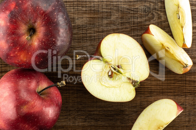 Fresh raw apple red delicious on brown wood