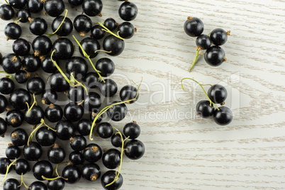 Fresh Raw Black Currant berry on grey wood