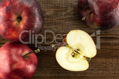 Fresh raw apple red delicious on brown wood