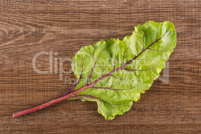 Fresh raw red beetroot on brown wood
