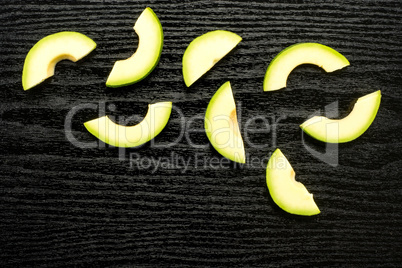 fresh Raw smooth avocado on black wood