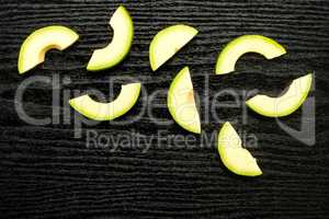 fresh Raw smooth avocado on black wood