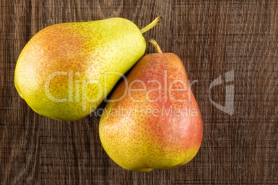 Fresh Raw red pear on brown wood