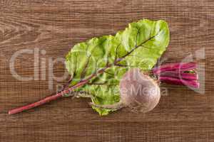Fresh raw red beetroot on brown wood