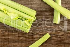 Fresh Celery isolated on brown wood