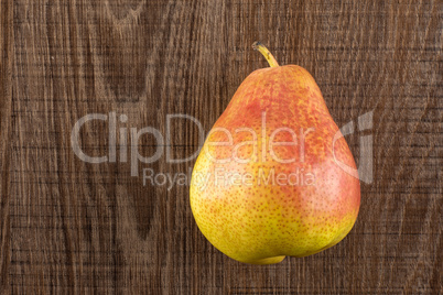 Fresh Raw red pear on brown wood