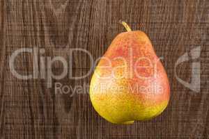 Fresh Raw red pear on brown wood
