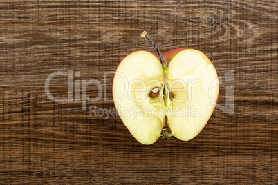 Fresh raw apple red delicious on brown wood
