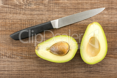 fresh Raw smooth avocado on brown wood