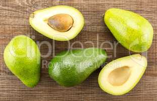 fresh Raw smooth avocado on brown wood