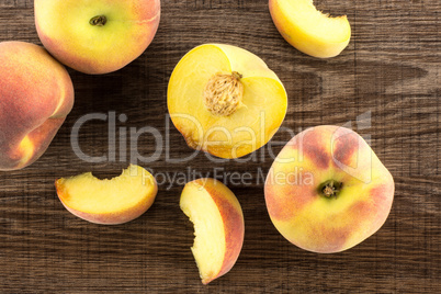 Fresh Raw yellow peach on brown wood