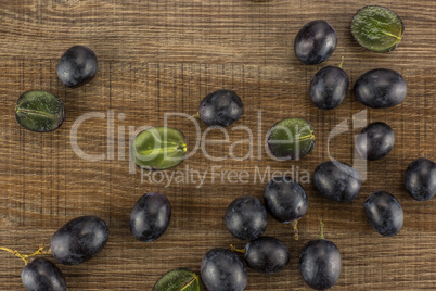 Fresh Black Wine Grapes on brown wood