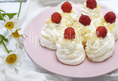 cakes made of egg white and whipped white cream with raspberries