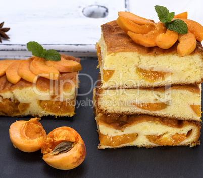 baked pieces of biscuit pie with apricots