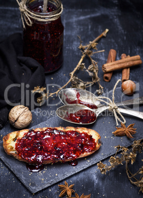 toast of white wheat bread smeared with raspberry jam