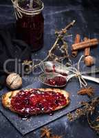 toast of white wheat bread smeared with raspberry jam
