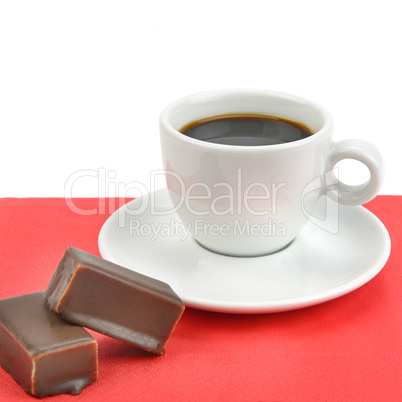 cup of coffee and chocolate candy isolated on white background