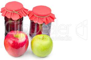 Apple jam in a glass jar, fresh red and green apples isolated on