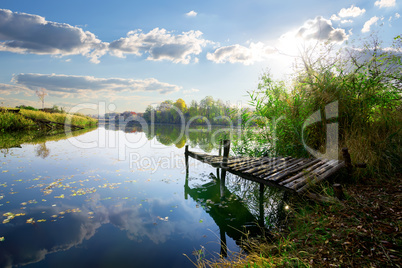 Old pier on pond