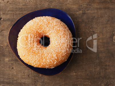 Tasty sweet donut on a rustic wooden table