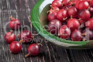 Closeup of red gooseberry in bowl